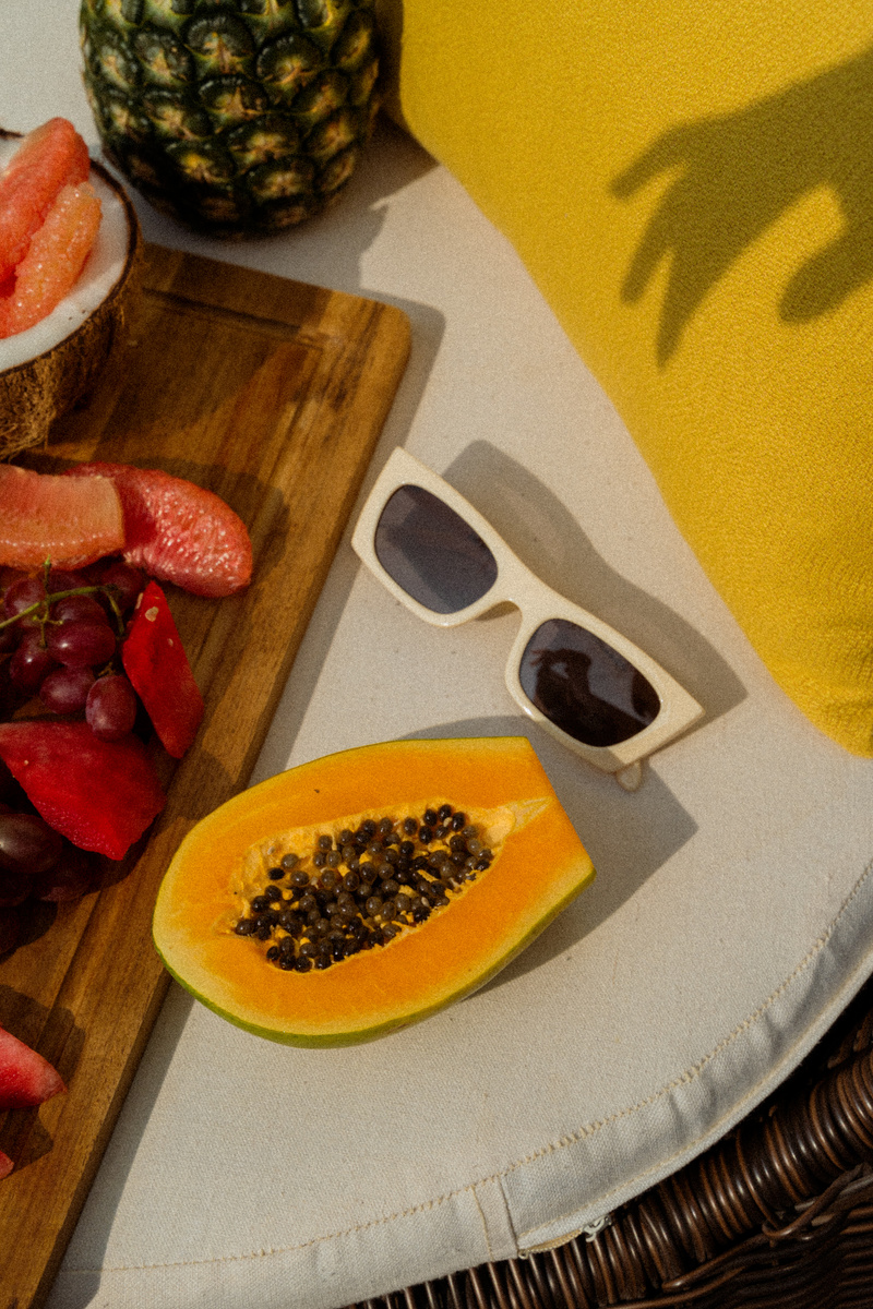 Sunglasses Next to Fresh Fruits 